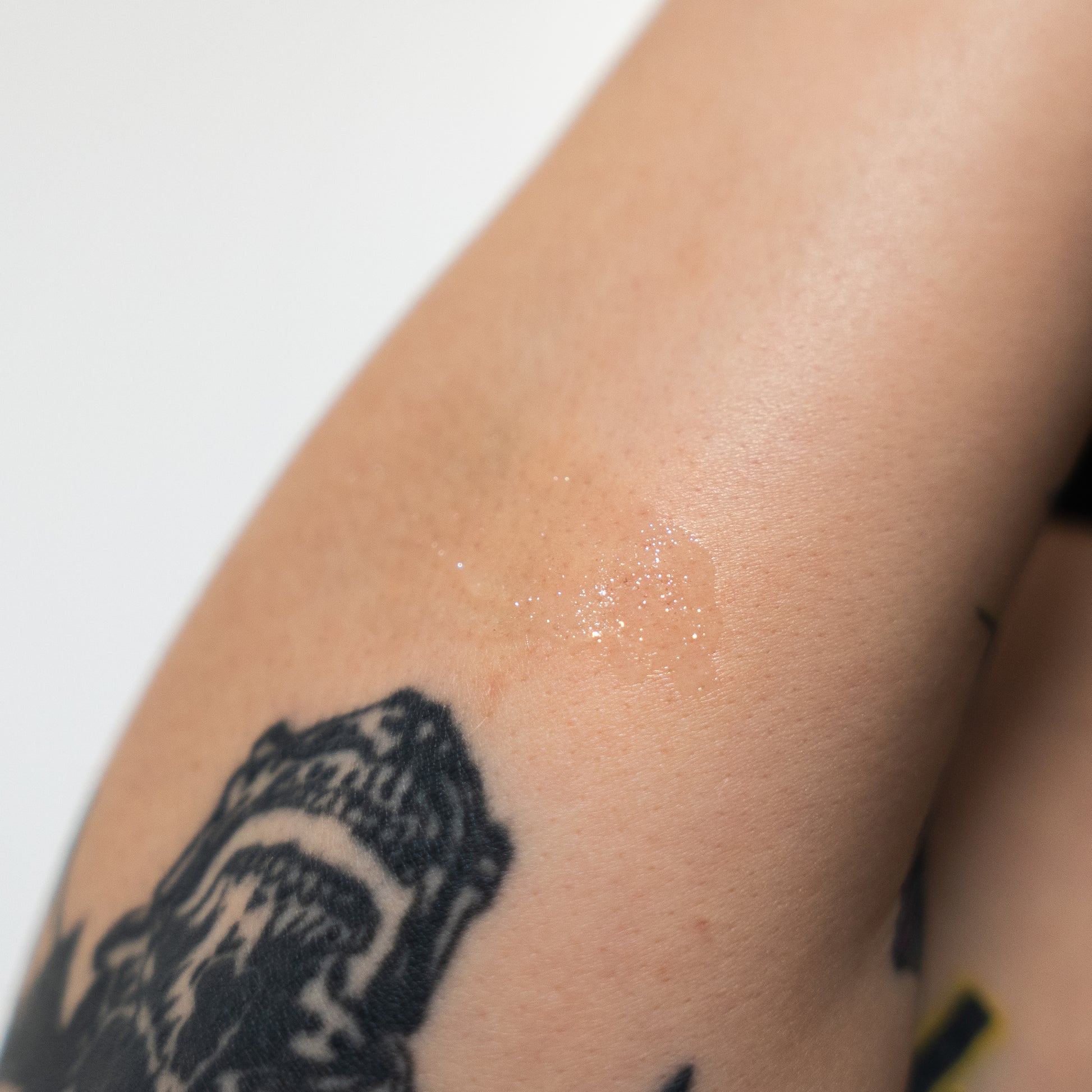 Tattoo on a person's arm with a white background
