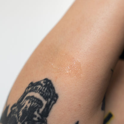 Tattoo on a person's arm with a white background