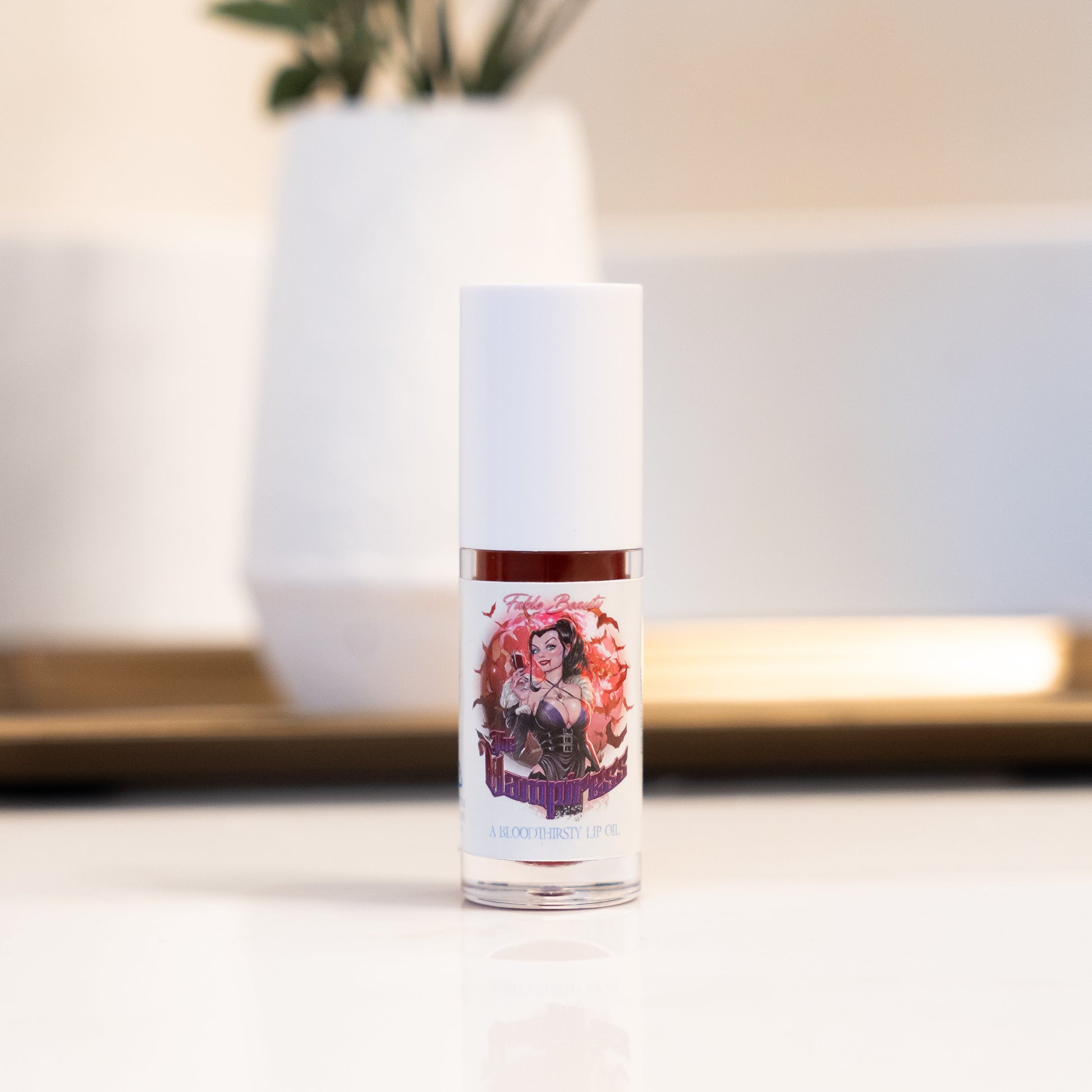 Skincare bottle with decorative label on a neutral background